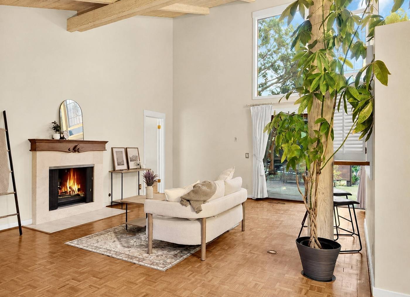 Staged living room with fireplace and layered seating